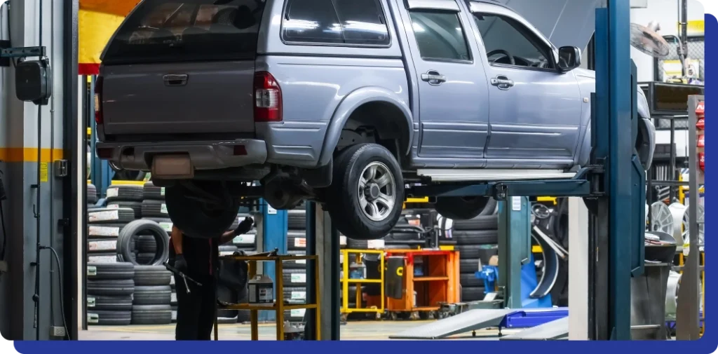 a car on a lift in a garage