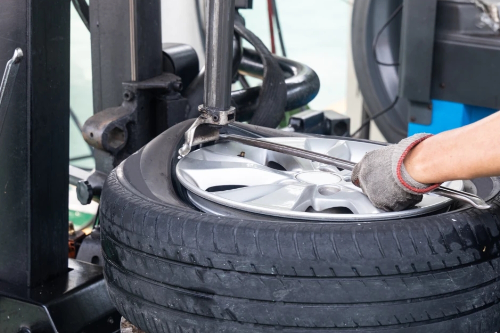 Winter Tire Services, Tire Services in Kodiak AK, At Midtown Auto Repair Services. Close-up view of a vehicle tire being serviced at an auto repair shop